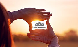 AAA logo in hands